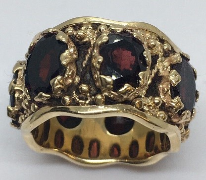 14 Karat yellow gold and garnet eternity band. Nobel Antique Jewelry Store, Santa Monica, Ca.